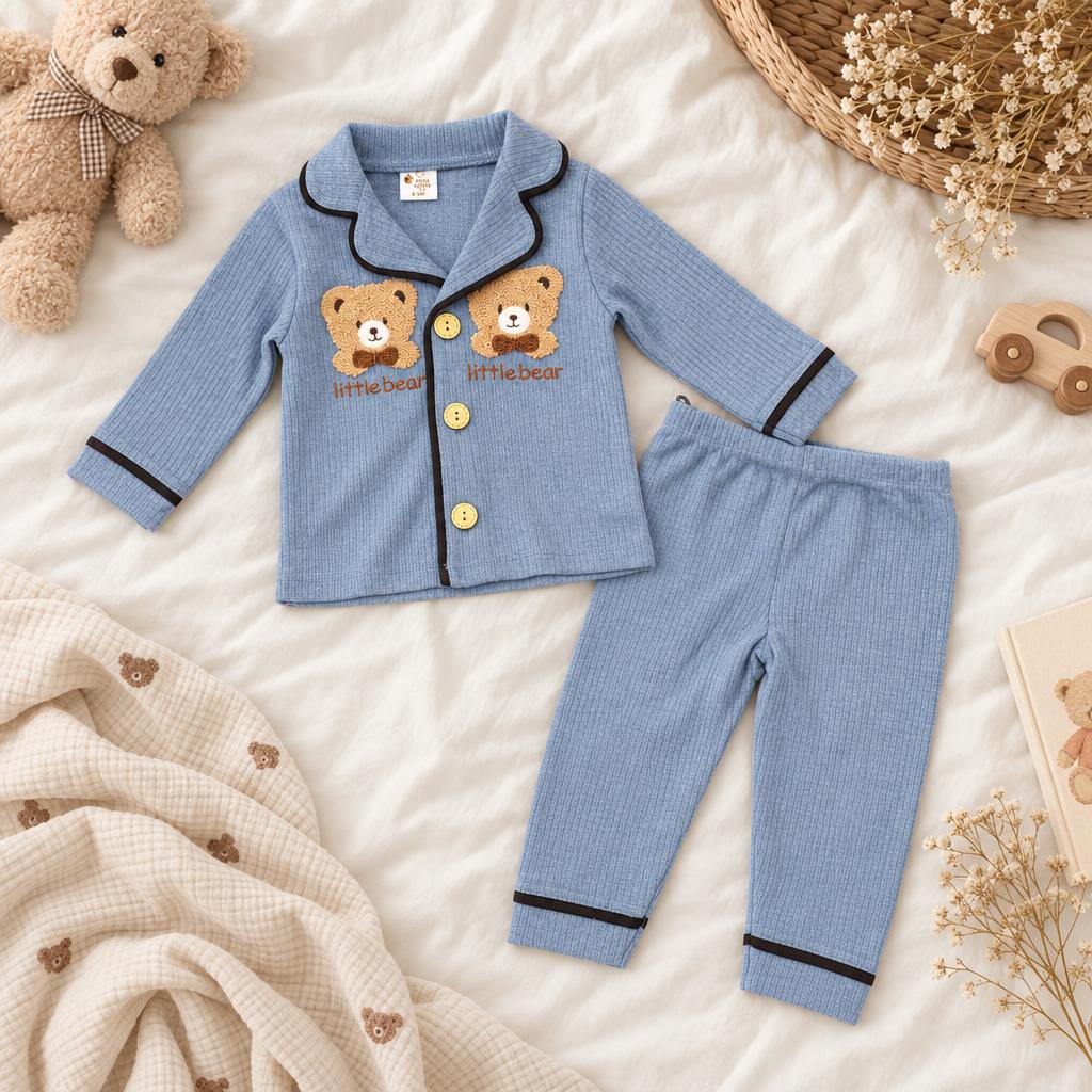 Flat-lay of the Blue ribbed-look two-piece night suit with bear chest appliques, Light Yellow buttons and matching full-length trousers.