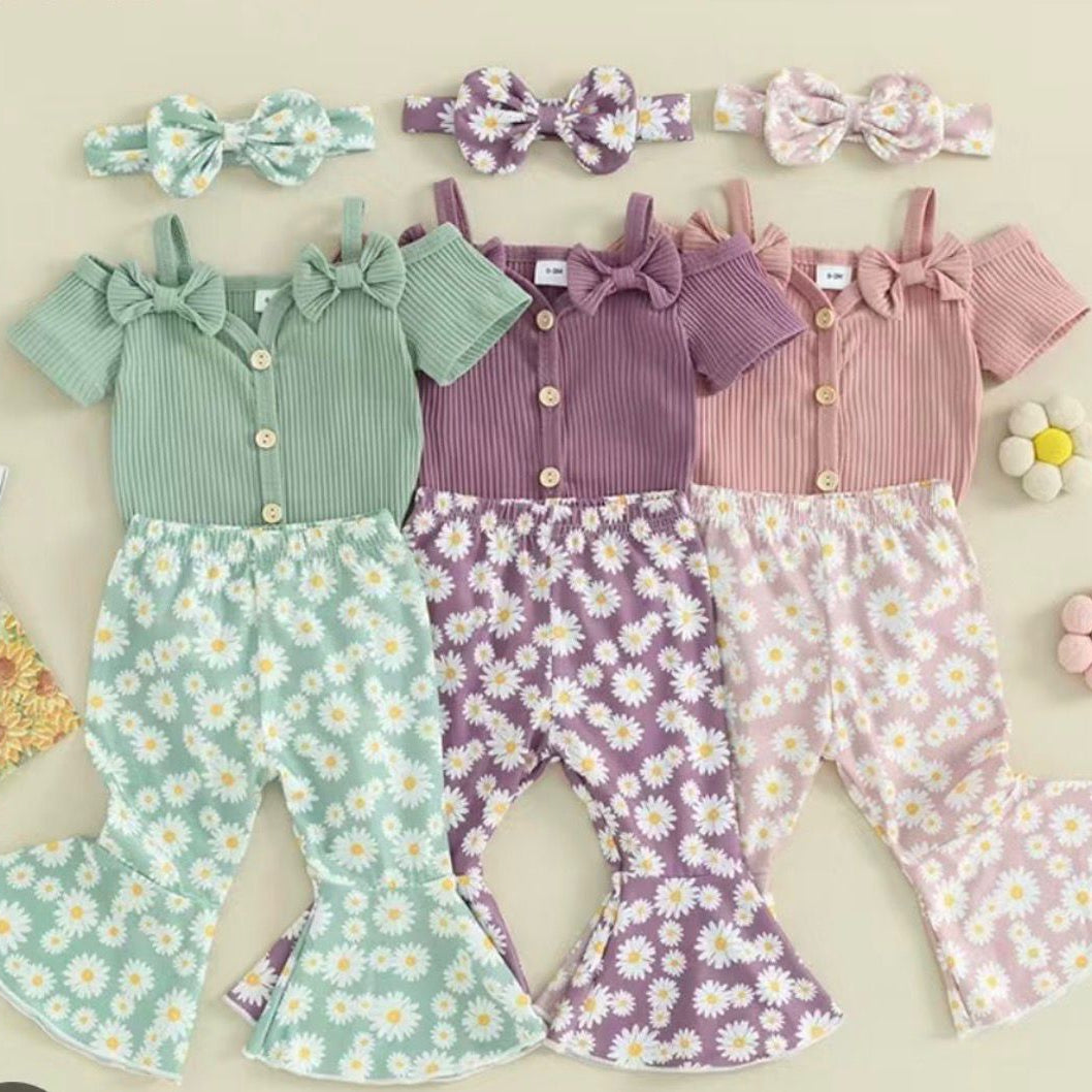 Three children's outfits with floral pants and matching headbands on a beige background.
