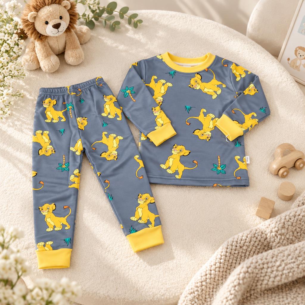 Grey blue lion cub print long-sleeve shirt and matching trousers, displayed flat with bright yellow ribbed neck and cuff details.