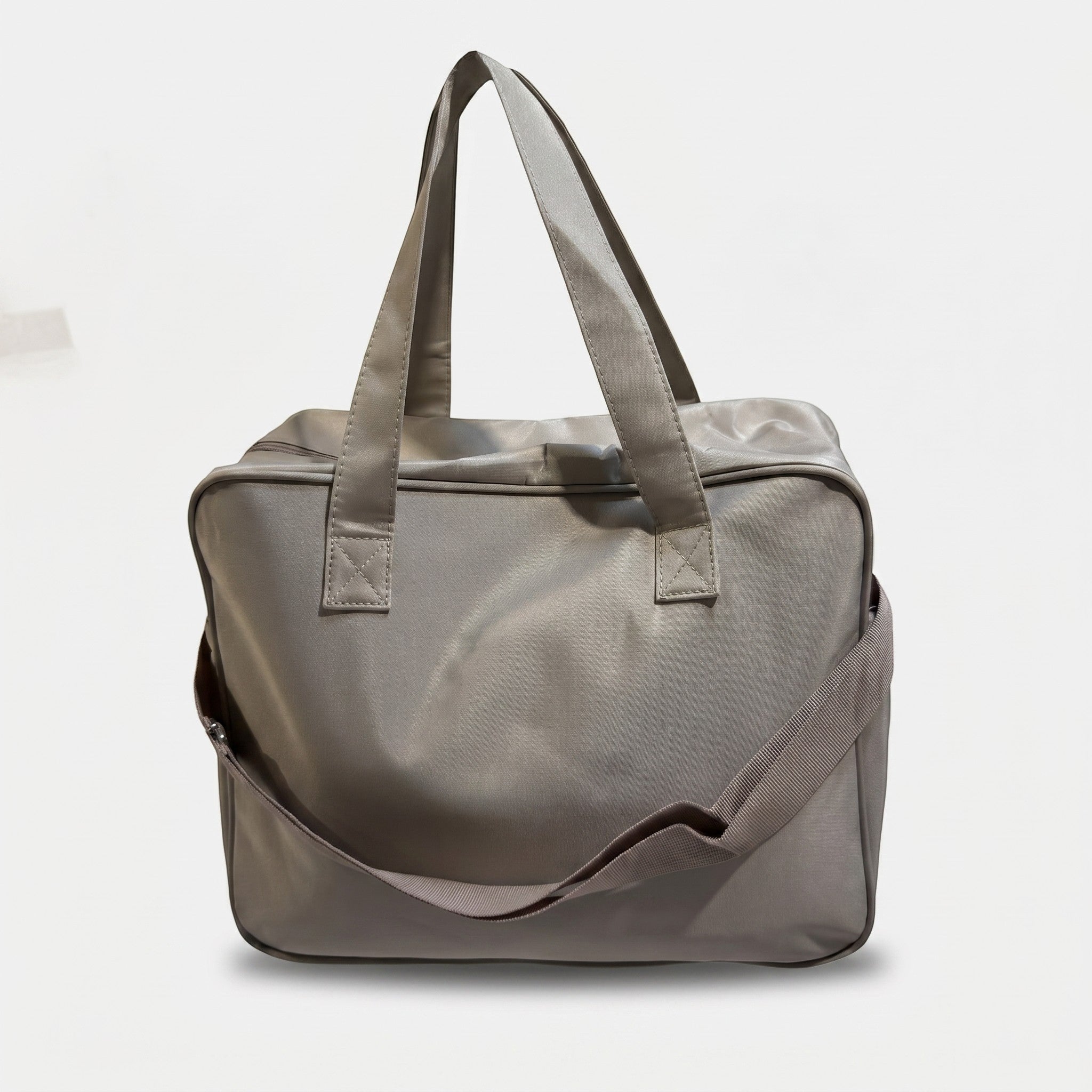 Faba Kids grey quilted baby diaper bag with a spacious design and comfortable shoulder straps for travel.