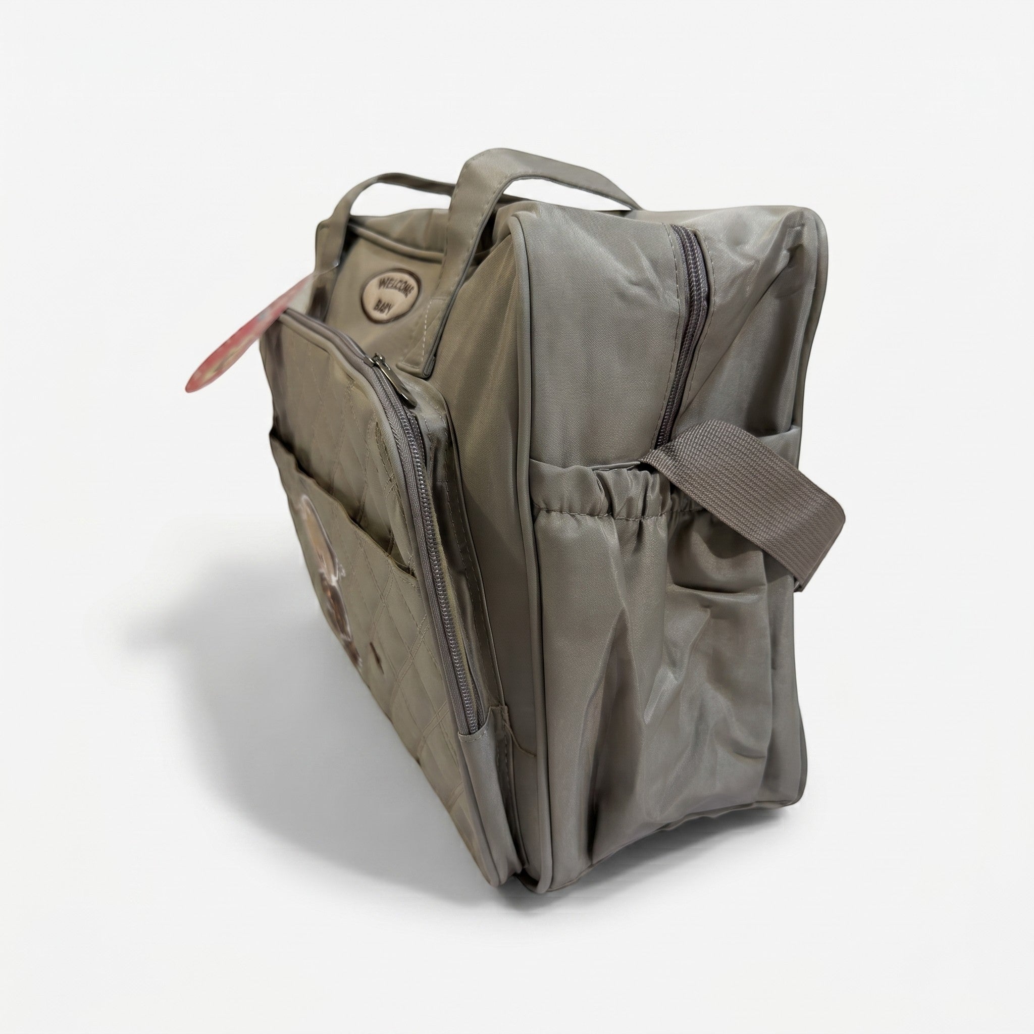 Faba Kids grey quilted baby diaper bag with embroidered bear design, zip-top closure, and spacious storage pockets.